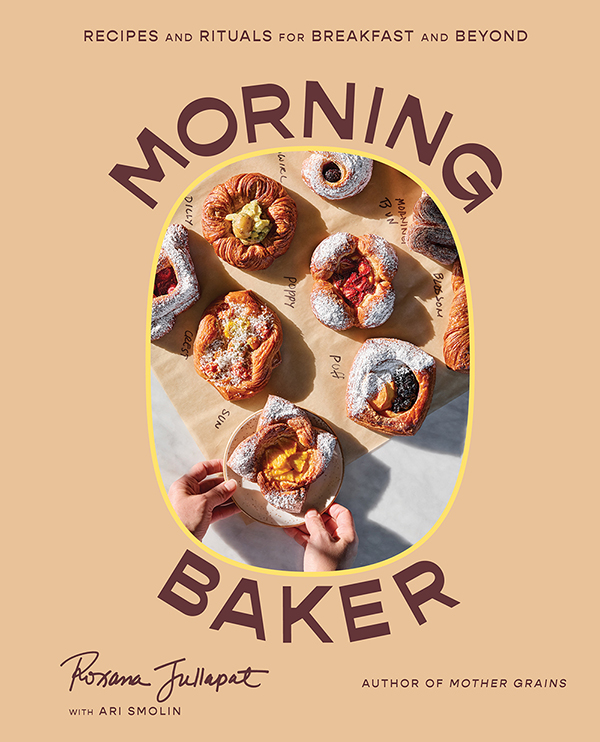 This photo featured in a review at GlamorosiCooks.com is from the cookbook MORNING BAKER (W. W. Norton & Company) by Roxana Jullapat with Ari Smolin. The book cover is tan with a vertical oval showing an assortment of baked goods. The book's title is positioned above and below the oval in dark brown lettering. Photo by Kristin Teig.